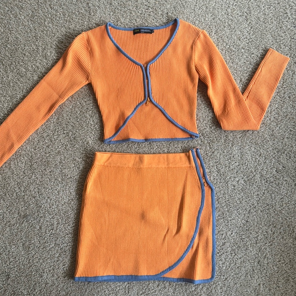 Matching sweater set, orange and blue, sleeves have thumb holes, size XS/s